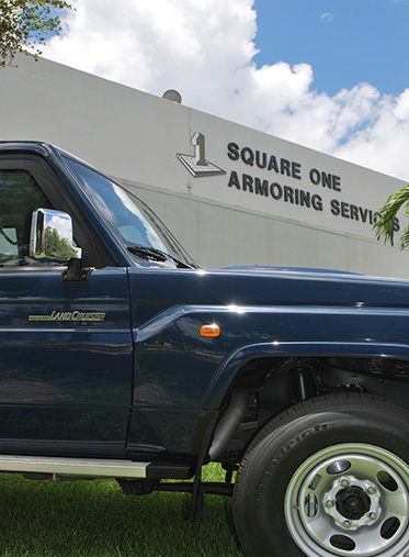 Armored Toyota Land Cruiser 70 Series parked outside the Square One Armoring facility in Miami